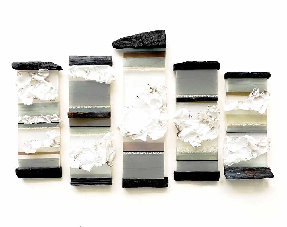 Marcia Steurmer, "Mini Mutated Carbon Footprint Barcodes," resin, thermo-formed paper, rice, graphics and charred wood, 2022. 