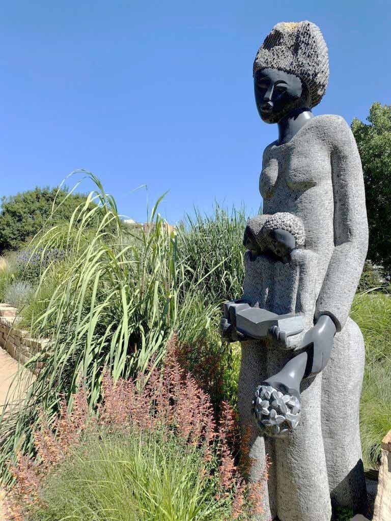 “So Proud of My Children” by Nicholas Kadzungura in the Ornamental Grasses Garden “So Proud of My Children” by Nicholas Kadzungura in the Ornamental Grasses Garden