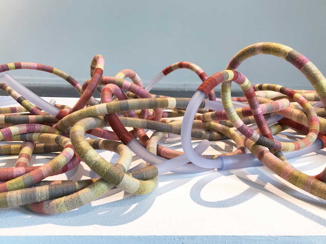 Tali Weinberg, "Bound," petrochemical-derived medical tubing, plant fibers, plant and insect dyes, 2024. Tali Weinberg, "Bound," petrochemical-derived medical tubing, plant fibers, plant and insect dyes, 2024.