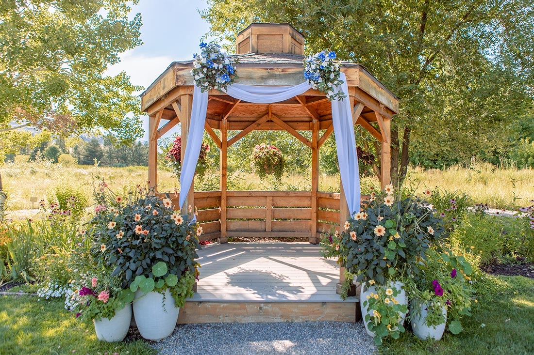 Open Air Chapel draped in blue sash and blue flowers