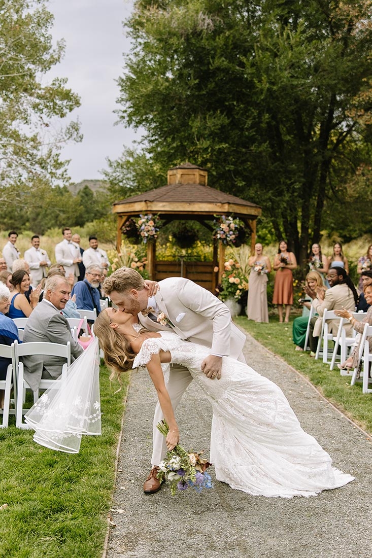 Groom holding bride at a wedding