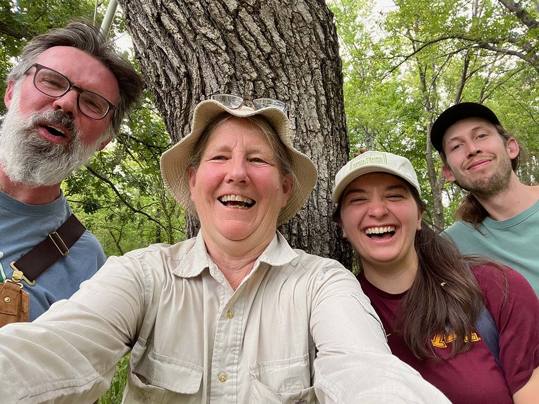 group selfie in front of tree