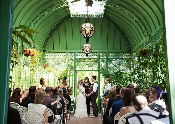 Couple getting married in solarium