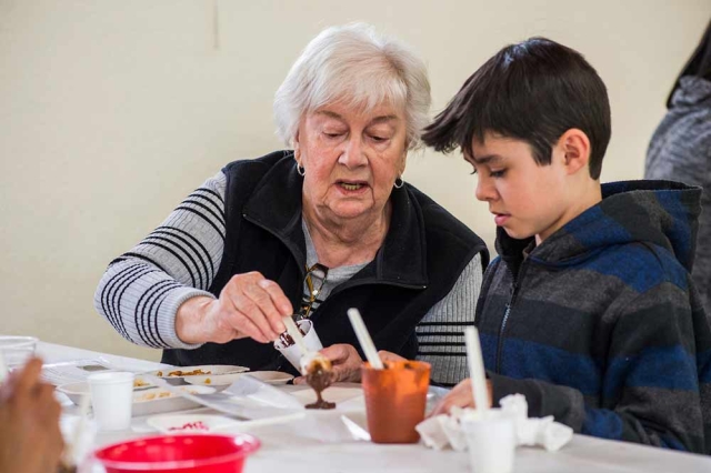 Family Programs Adult and child doing a craft together
