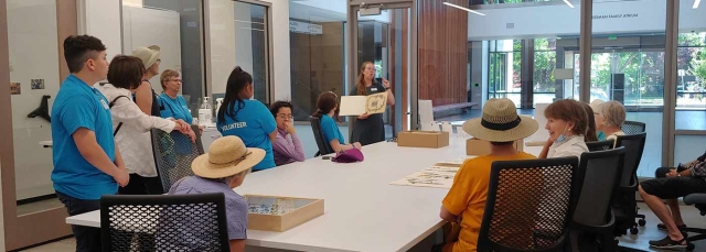 A group of people taking an Herbarium tour