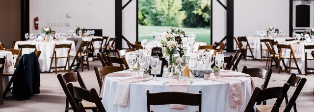 Tables and chairs set up for a wedding reception. 