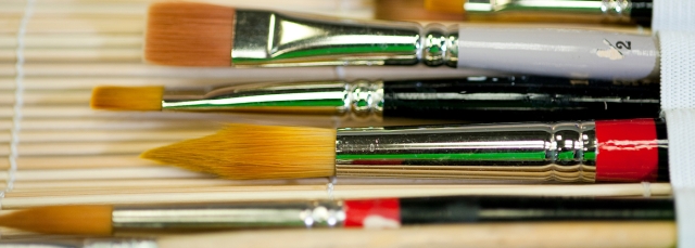Paintbrushes sitting on a table