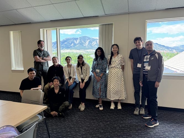 group of people in front of windows