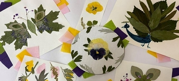 Artwork created with leaves and pressed flowers
