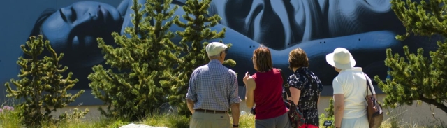 people looking at urban-style painting