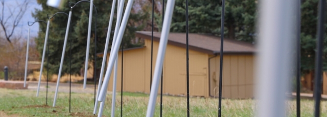 Nathan Hall, Chime Walk II, 11 tuned windchimes and welded shepherds’ hooks and cables, 2021. Photo courtesy of Arvada Parks and Recreation. 