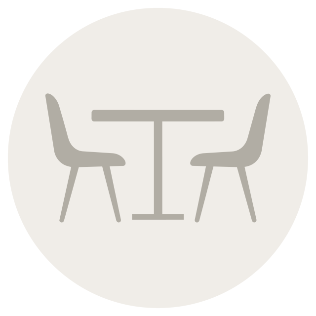 A graphic of a table and two chairs
